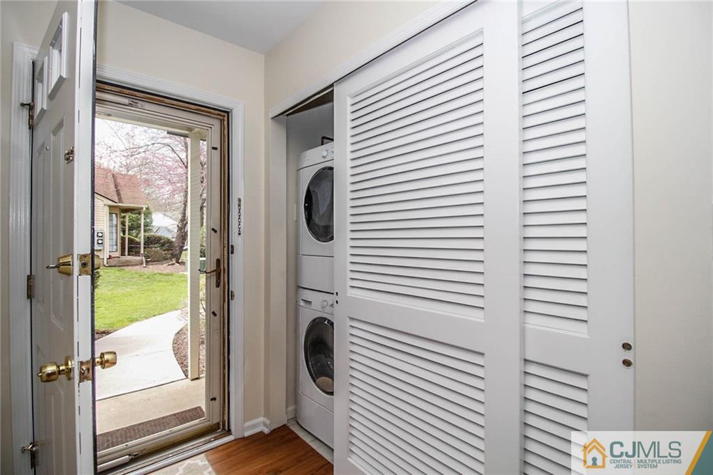 2106 Timber Oaks Road, Unit 2106 Edison, NJ 08820 - Photo 23 of 25 a view of a hallway with washer and dryer