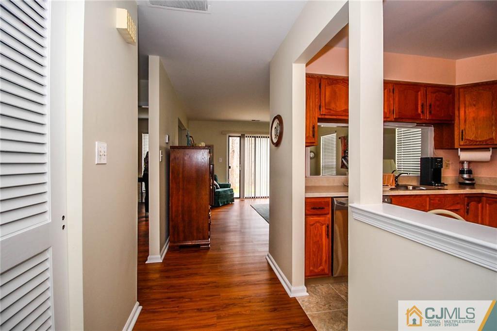 2106 Timber Oaks Road, Unit 2106 Edison, NJ 08820 - Photo 5 of 25 a view of a kitchen from the hallway
