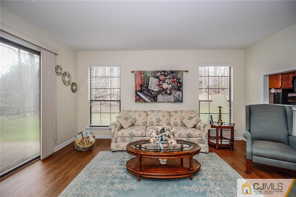 2106 Timber Oaks Road, Unit 2106 Edison, NJ 08820 - Photo 7 of 25 a living room with furniture and a potted plant