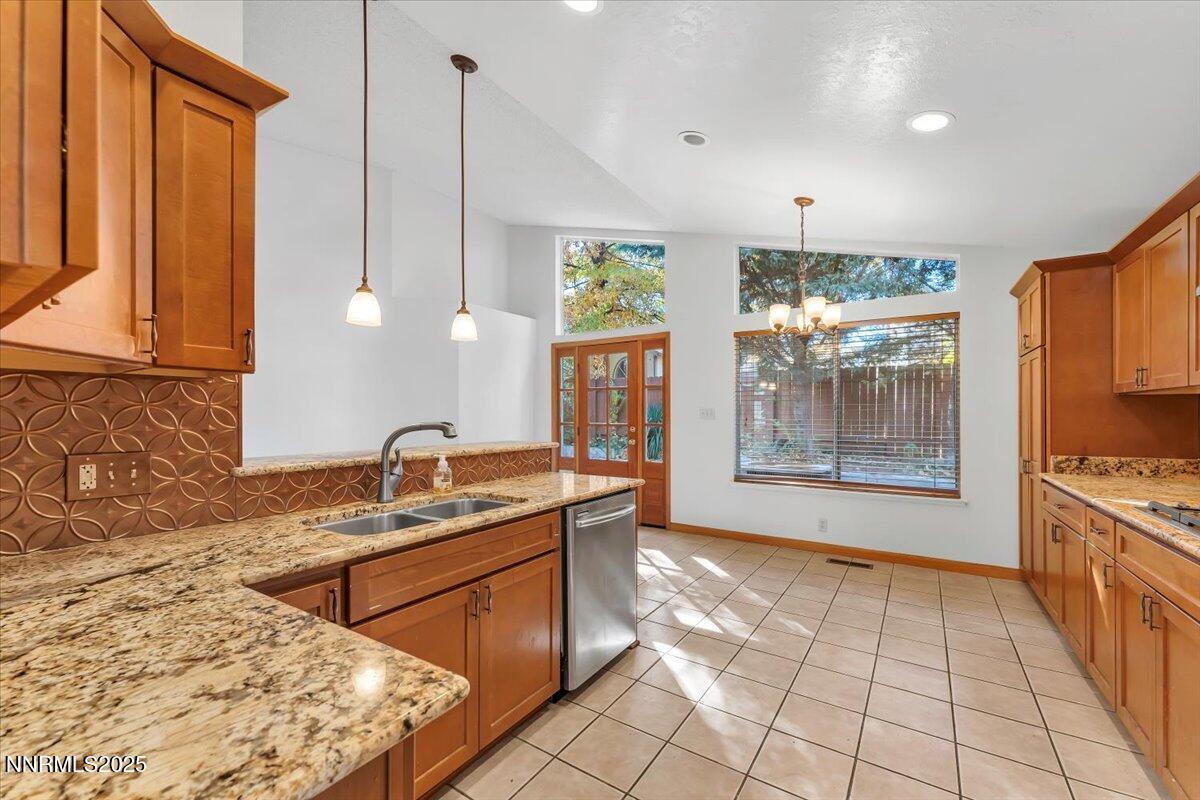 4434 Whitney Circle Sparks, NV 89436 - Photo 16 of 32 a kitchen with stainless steel appliances granite countertop a sink and a stove