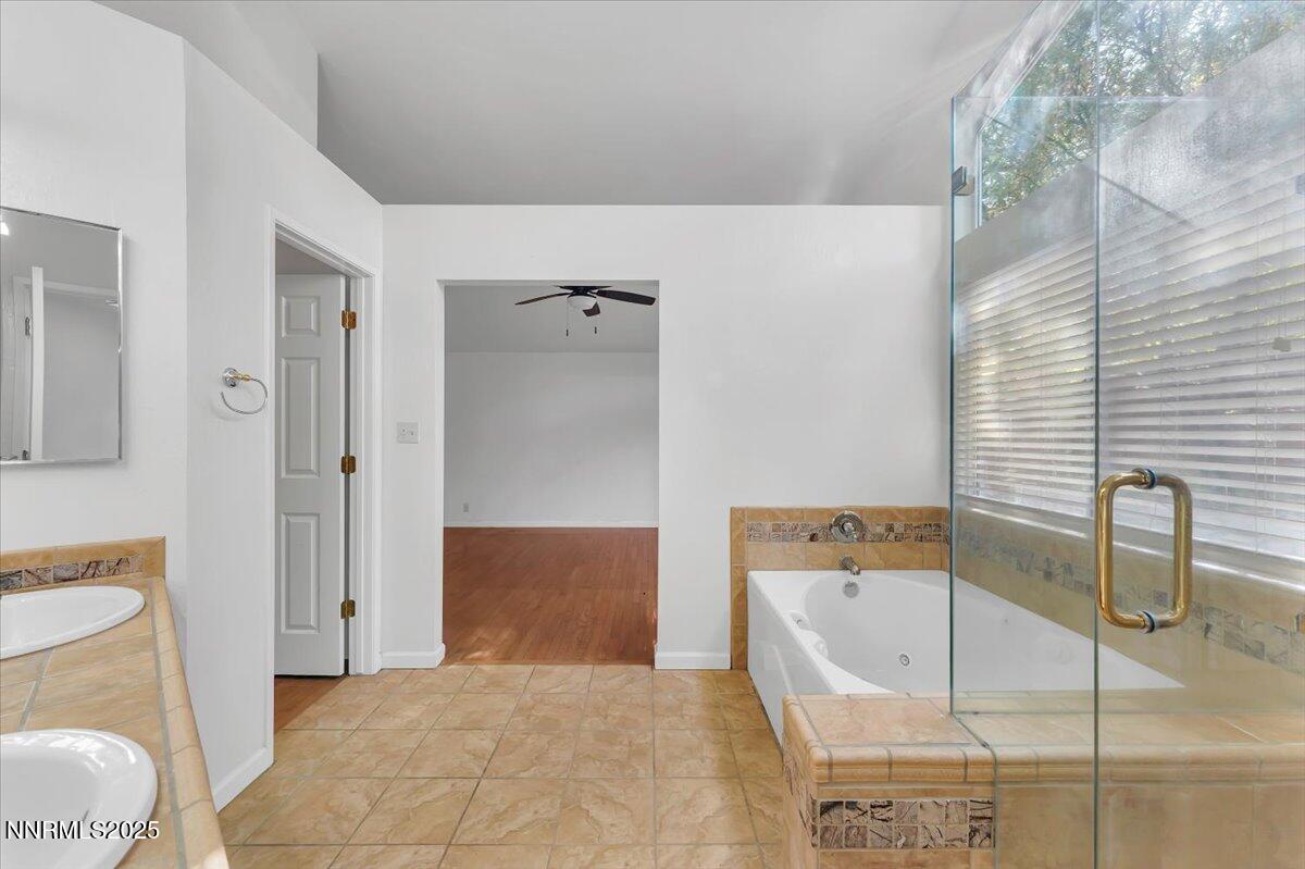 4434 Whitney Circle Sparks, NV 89436 - Photo 21 of 32 a bathroom with a tub sink and toilet