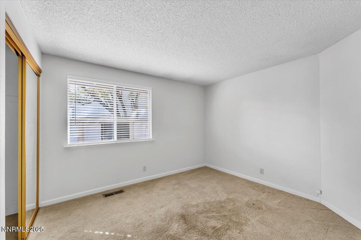 4434 Whitney Circle Sparks, NV 89436 - Photo 22 of 32 an empty room with a window