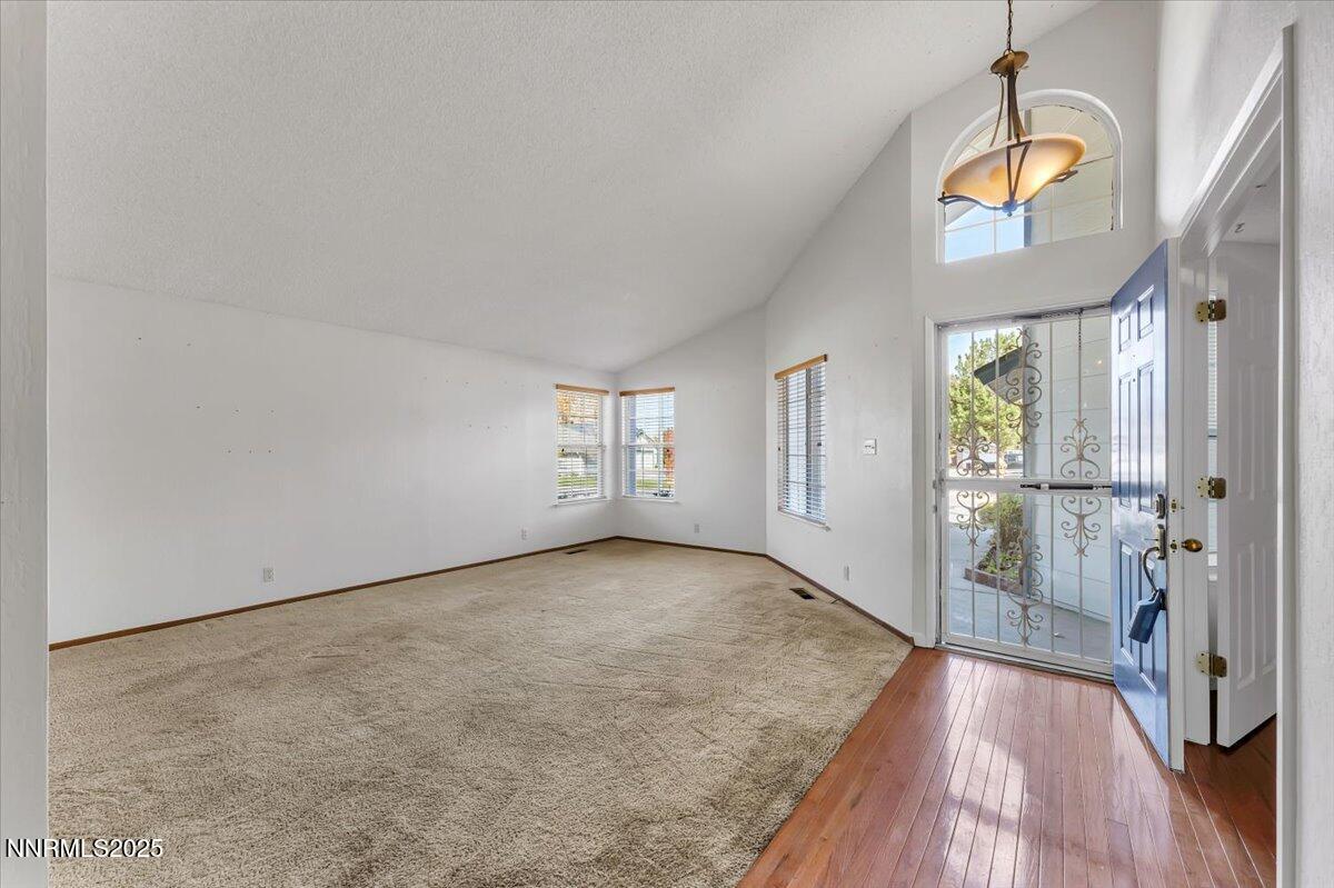 4434 Whitney Circle Sparks, NV 89436 - Photo 6 of 32 a view of a room with wooden floor and entryway