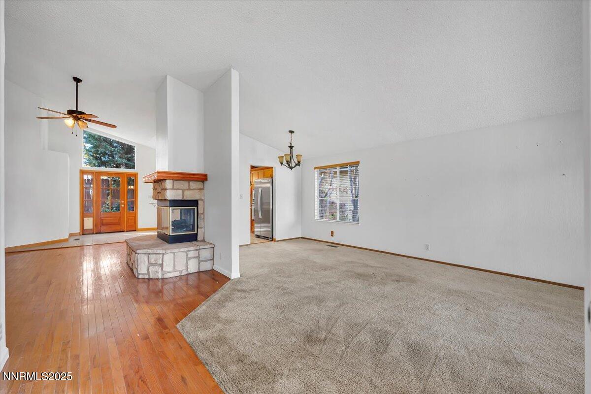 4434 Whitney Circle Sparks, NV 89436 - Photo 7 of 32 a view of a livingroom with wooden floor and a kitchen space