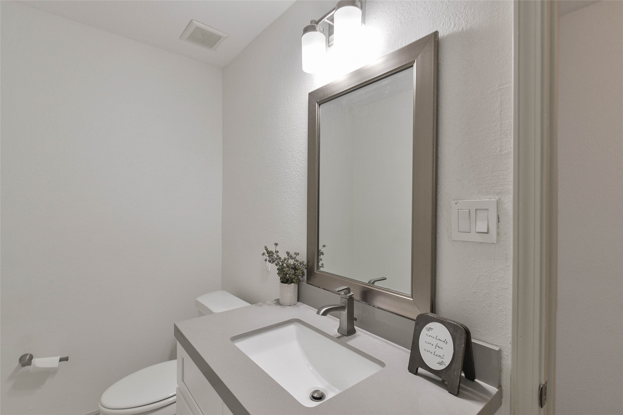 531 Brandon Road Conroe, TX 77302 - Photo 11 of 33 a bathroom with a sink and a mirror