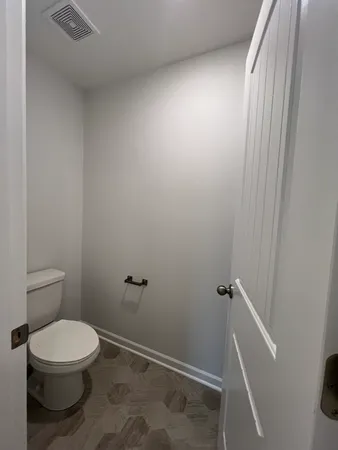 a view of a room with racks on the wall