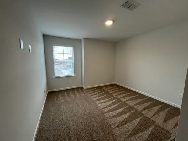 a view of an empty room and window