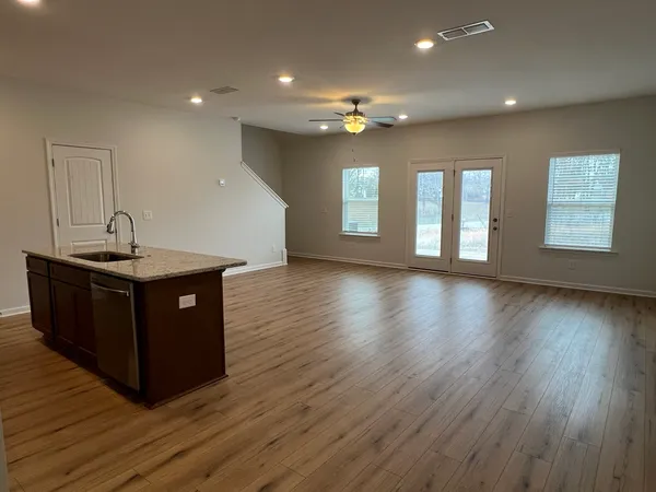 a view of kitchen with cabinets