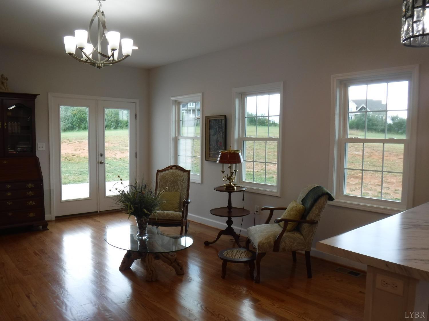 203 Longhill Road Goode, VA 24556 - Photo 17 of 26 a living room with furniture window and wooden floor