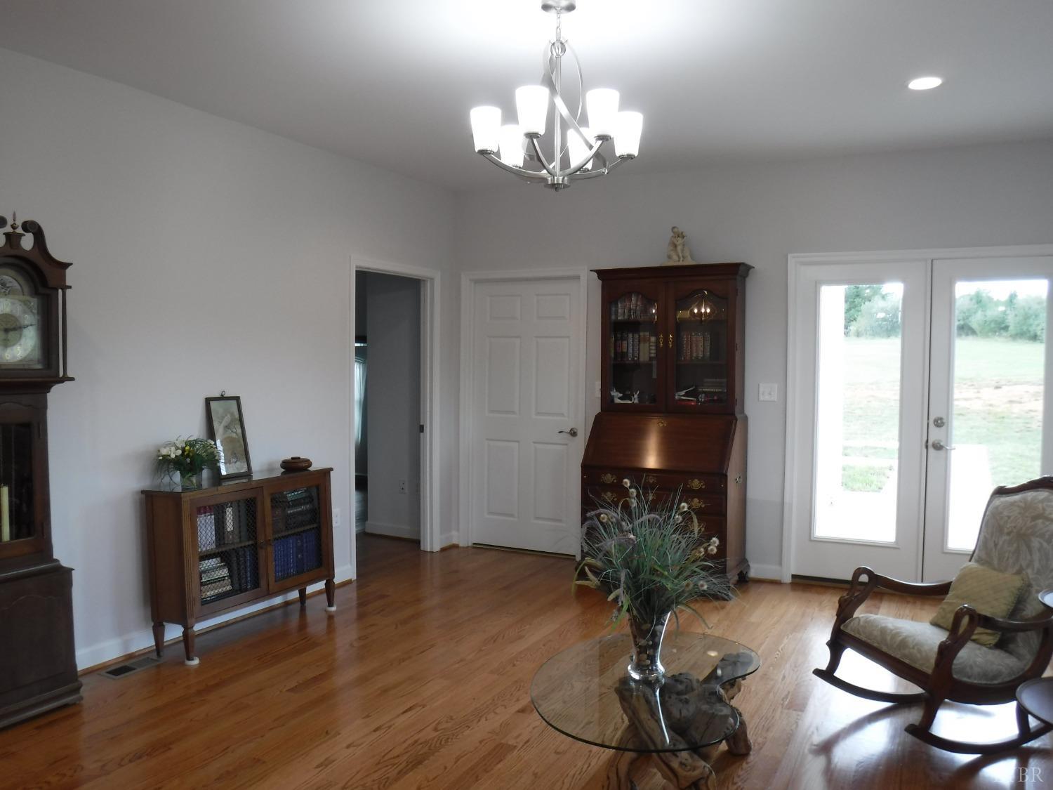 203 Longhill Road Goode, VA 24556 - Photo 18 of 26 a view of a livingroom with furniture window and wooden floor