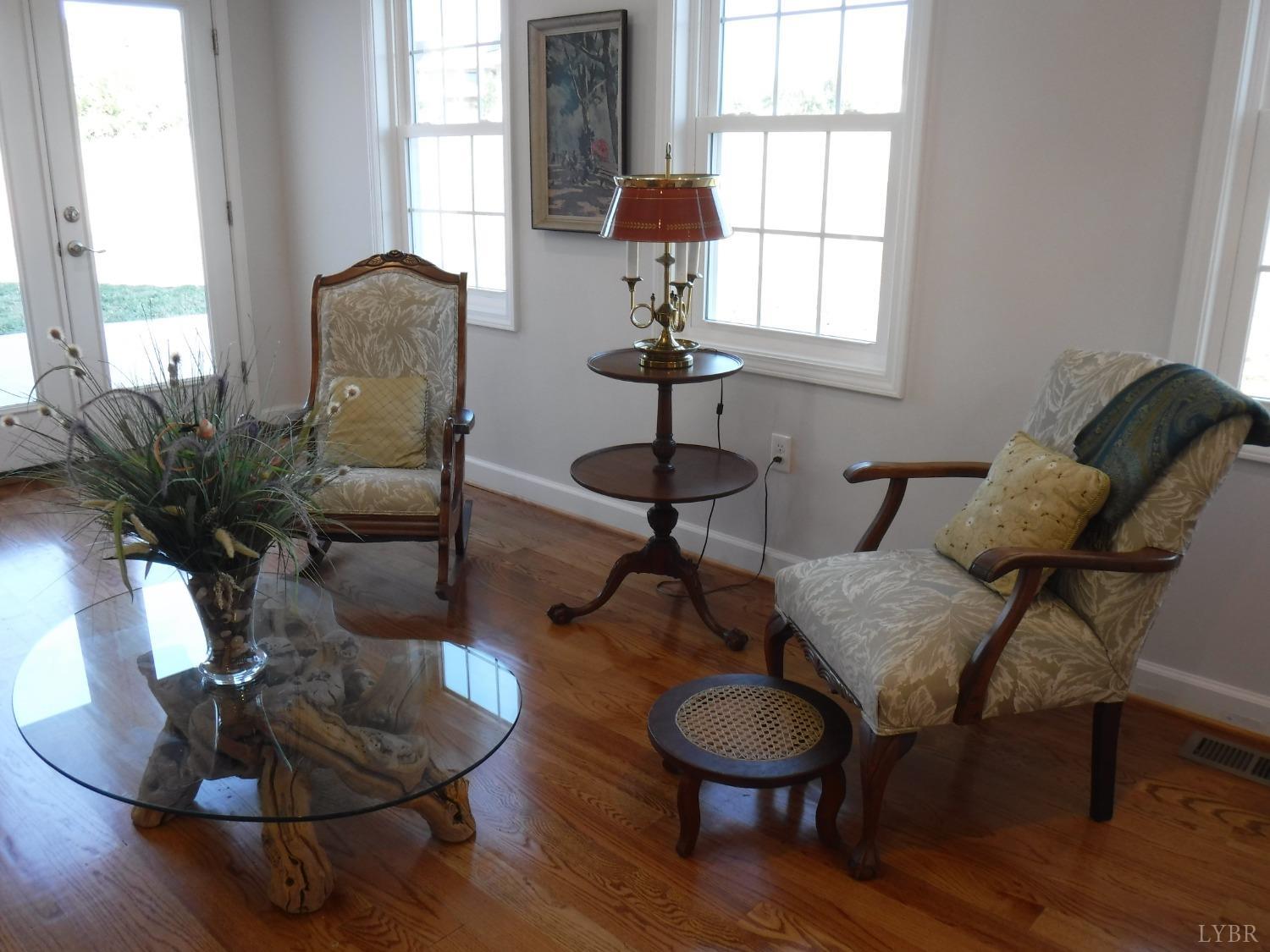 203 Longhill Road Goode, VA 24556 - Photo 19 of 26 a living room with furniture and a potted plant