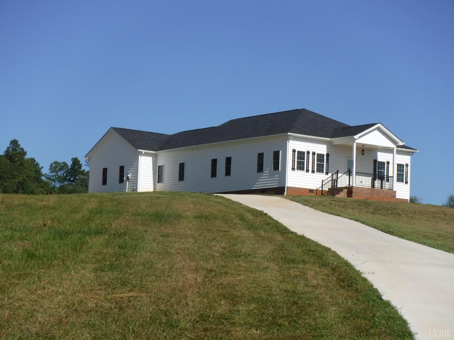 203 Longhill Road Goode, VA 24556 - Photo 4 of 26 a house view with a garden space