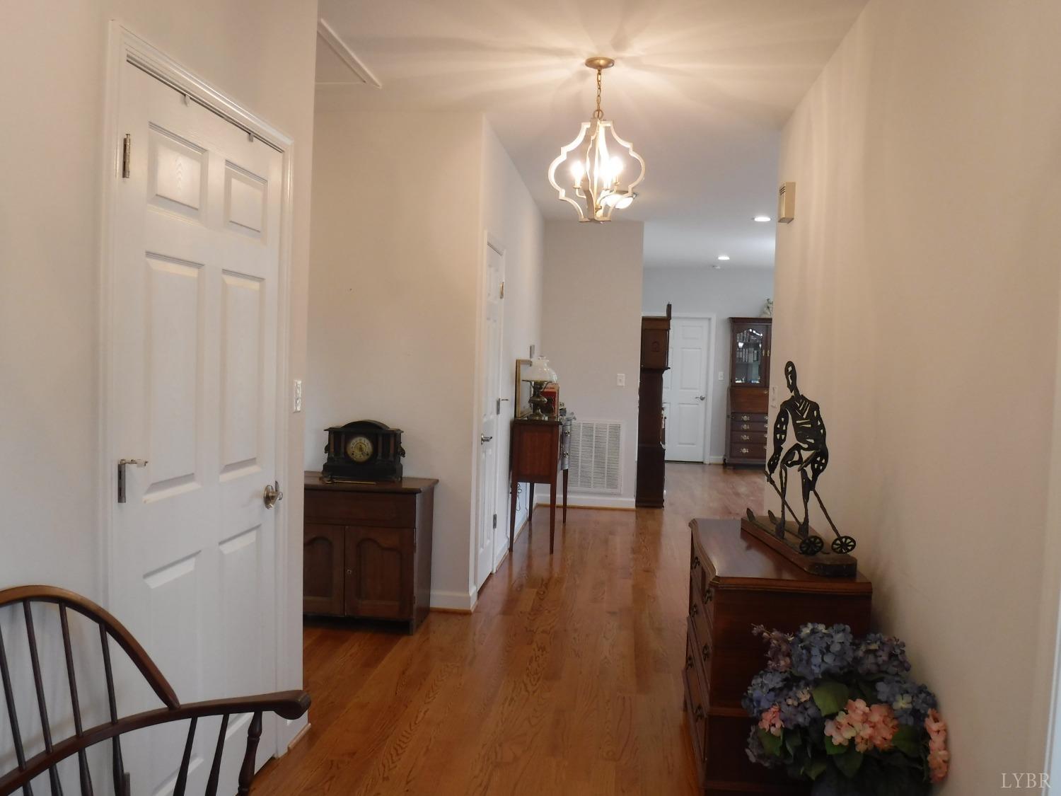 203 Longhill Road Goode, VA 24556 - Photo 8 of 26 a view of a hallway with wooden floor and staircase
