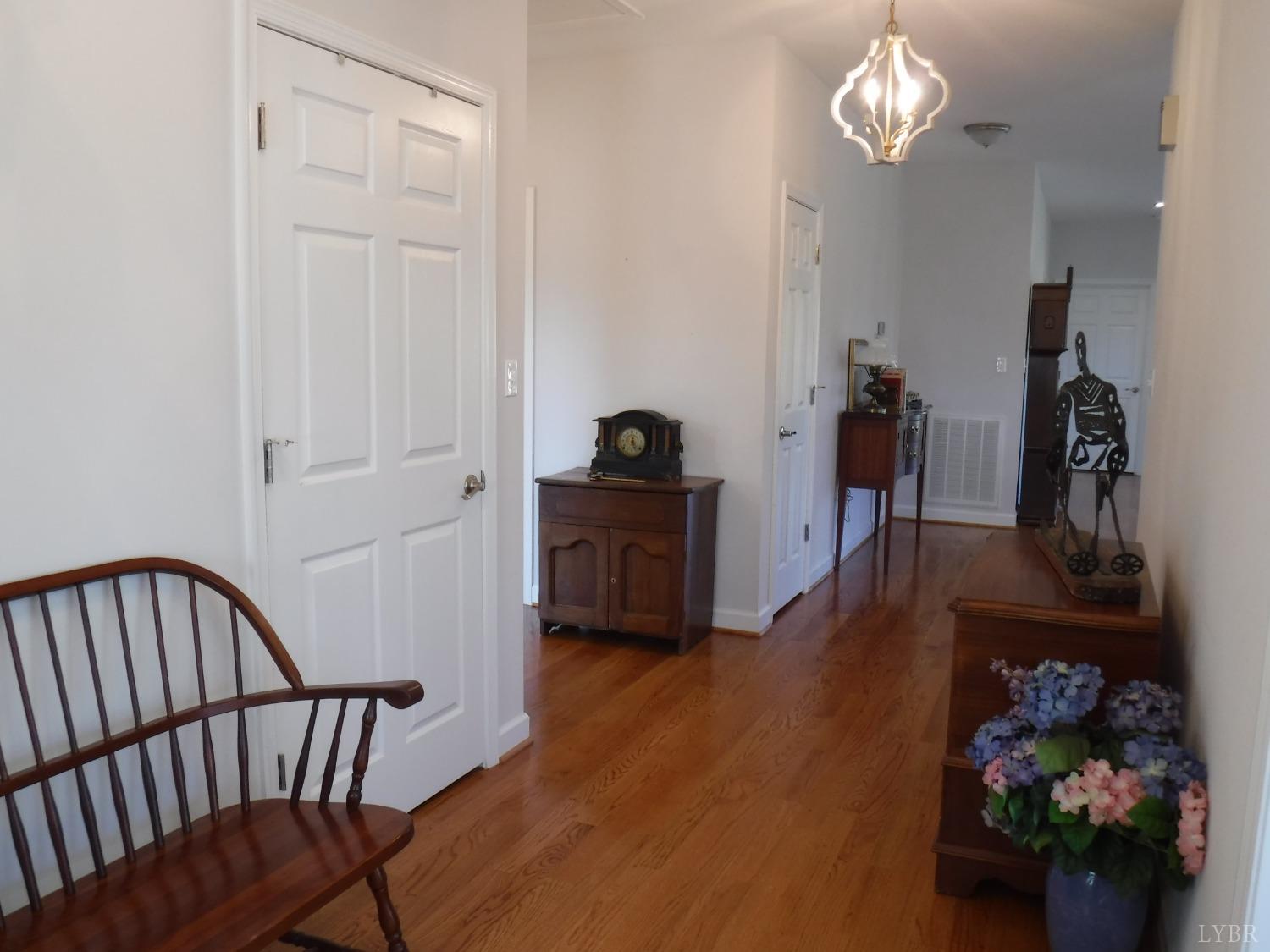 203 Longhill Road Goode, VA 24556 - Photo 9 of 26 a hallway with wooden floor