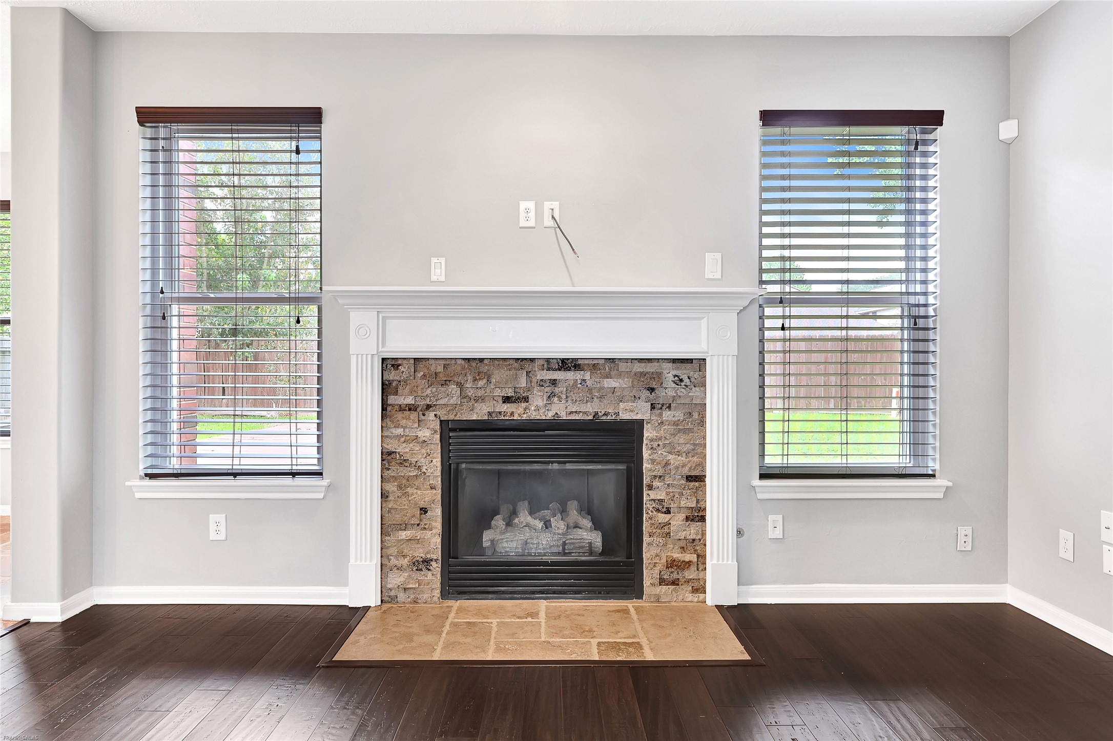 10219 Sable Trail Lane Houston, TX 77064 - Photo 11 of 31 a living room with a fireplace and a window