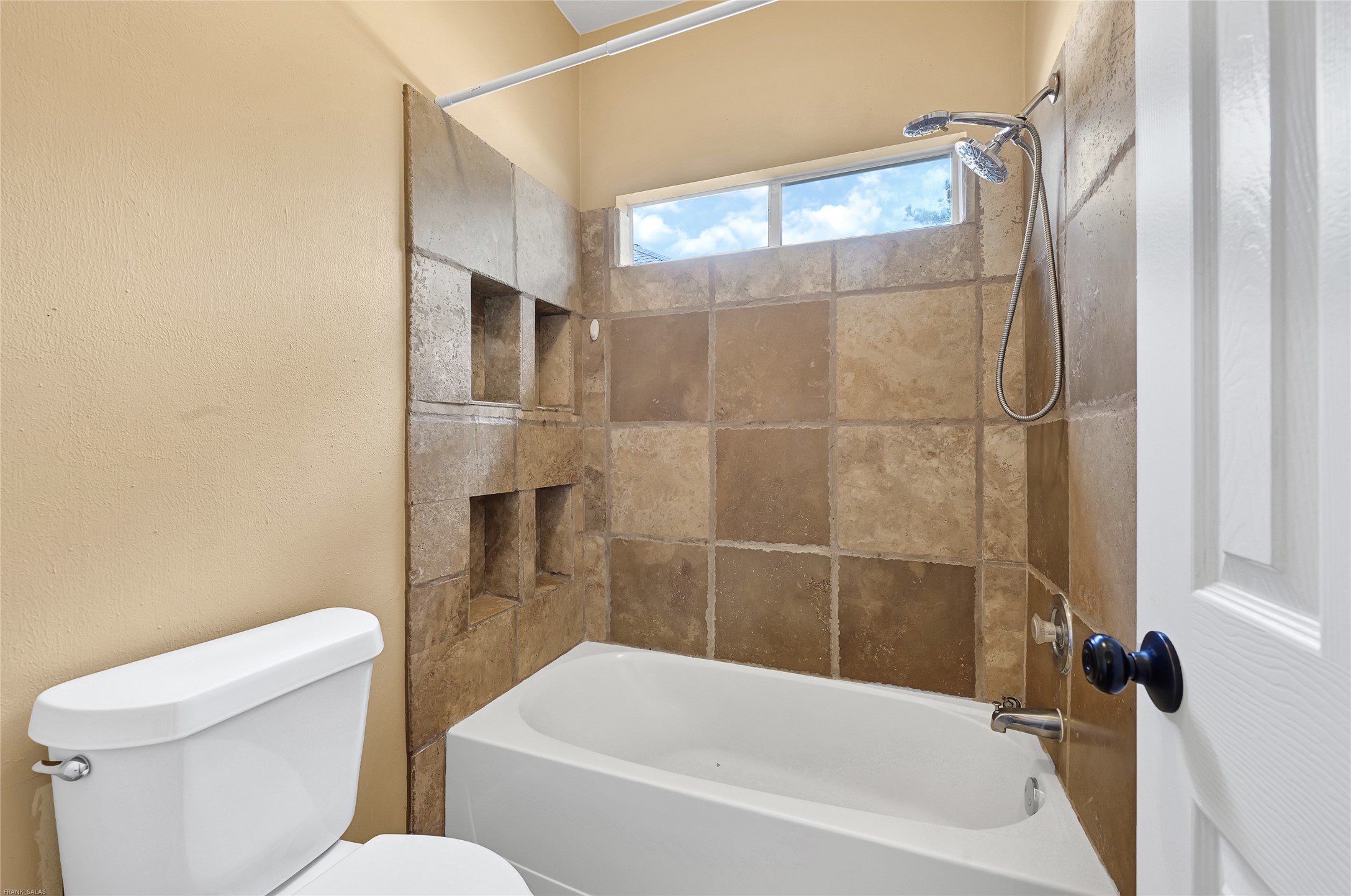 10219 Sable Trail Lane Houston, TX 77064 - Photo 13 of 31 a bathroom with a toilet and a bathtub