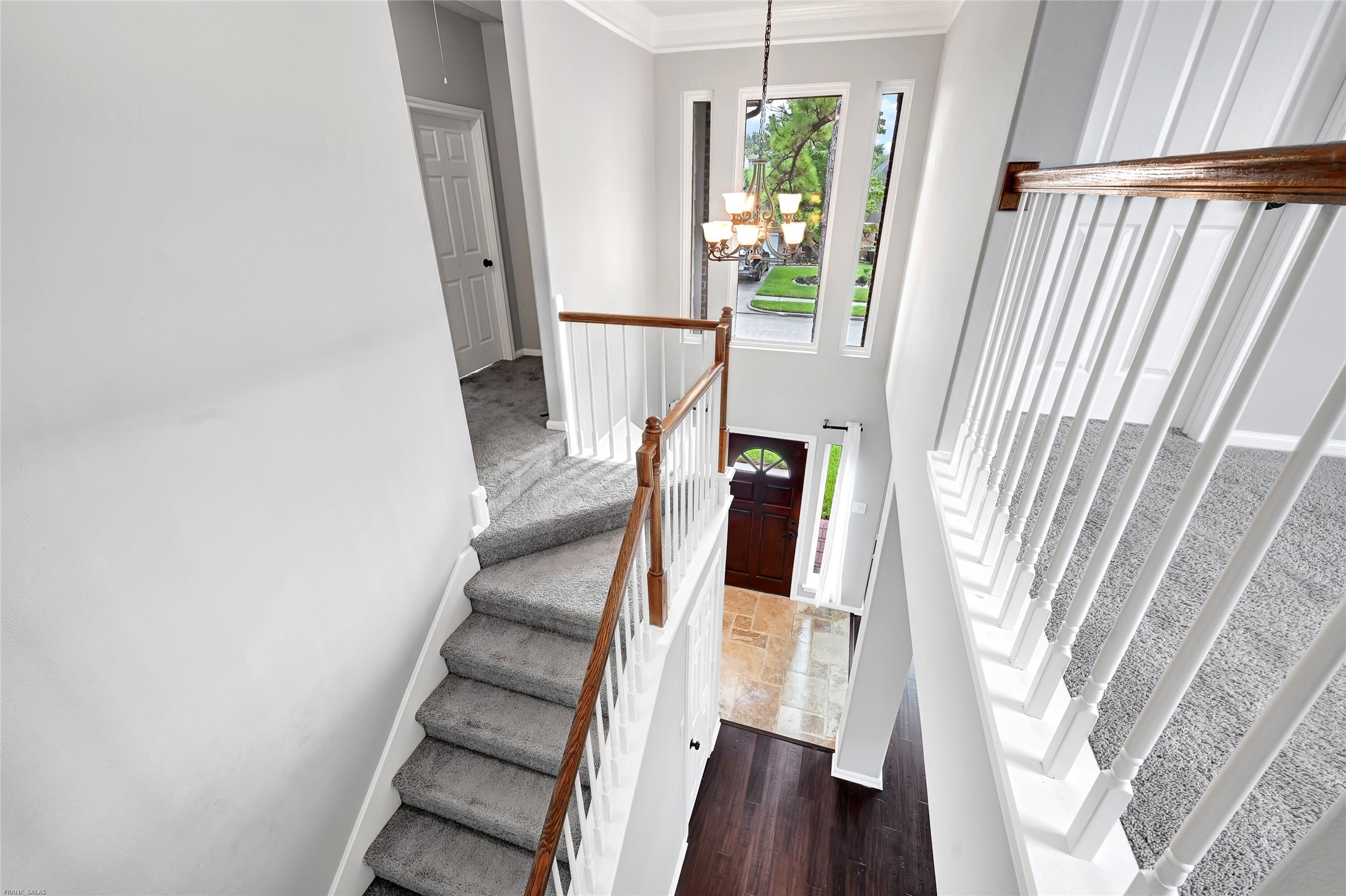 10219 Sable Trail Lane Houston, TX 77064 - Photo 17 of 31 a view of staircase with wooden floor and window
