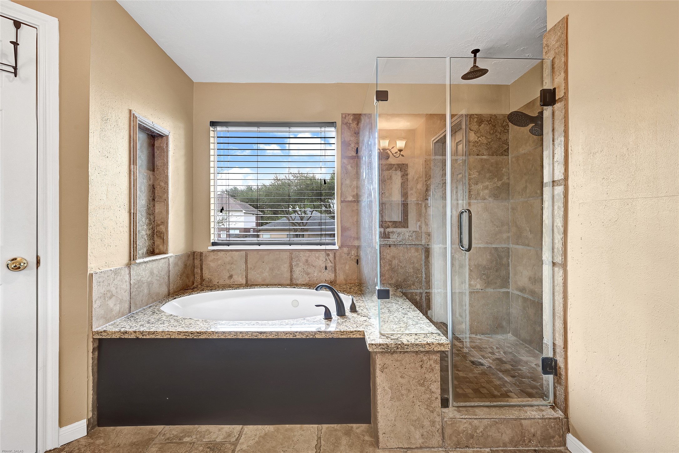 10219 Sable Trail Lane Houston, TX 77064 - Photo 21 of 31 a bathroom with a granite countertop bathtub and shower