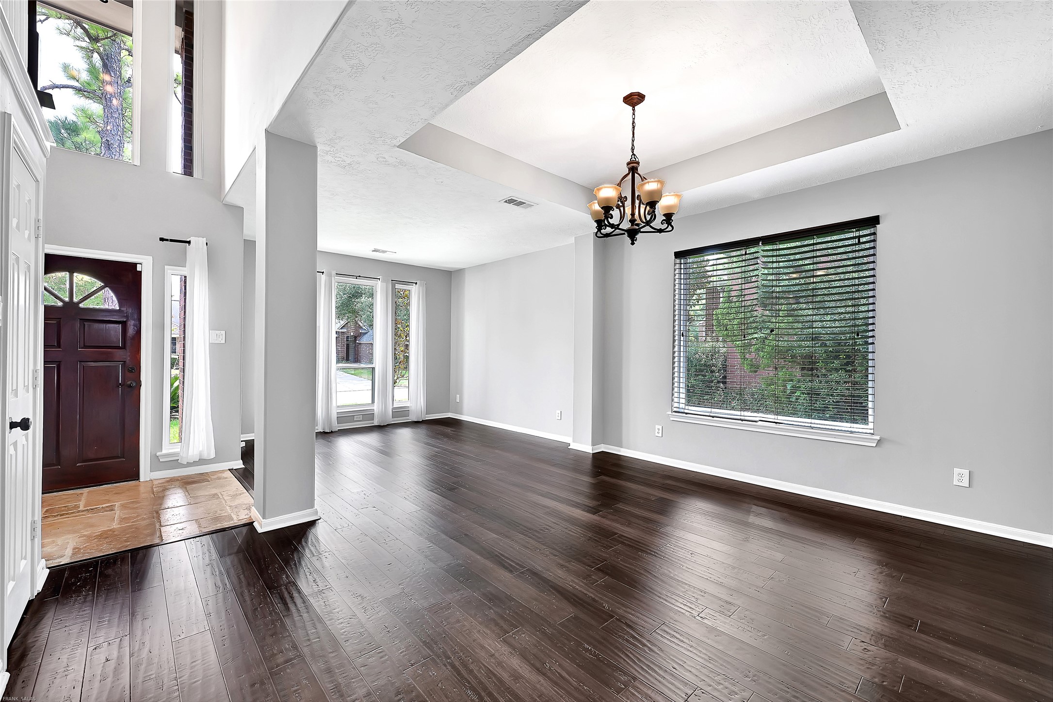 10219 Sable Trail Lane Houston, TX 77064 - Photo 3 of 31 a view of a room with wooden floor fireplace and windows