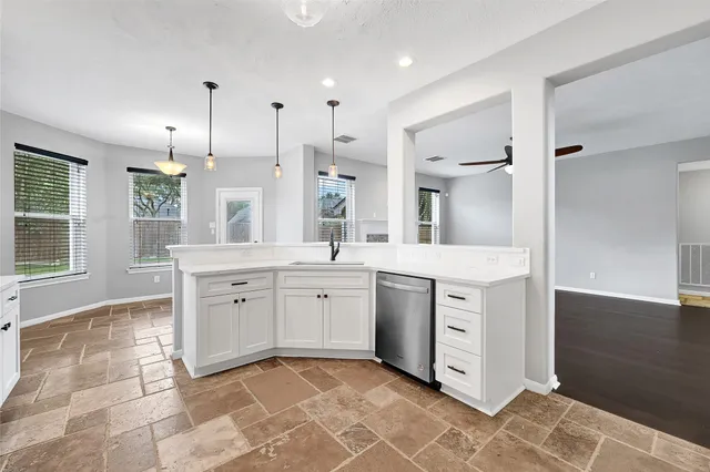 a large bathroom with a large mirror vanity and sink
