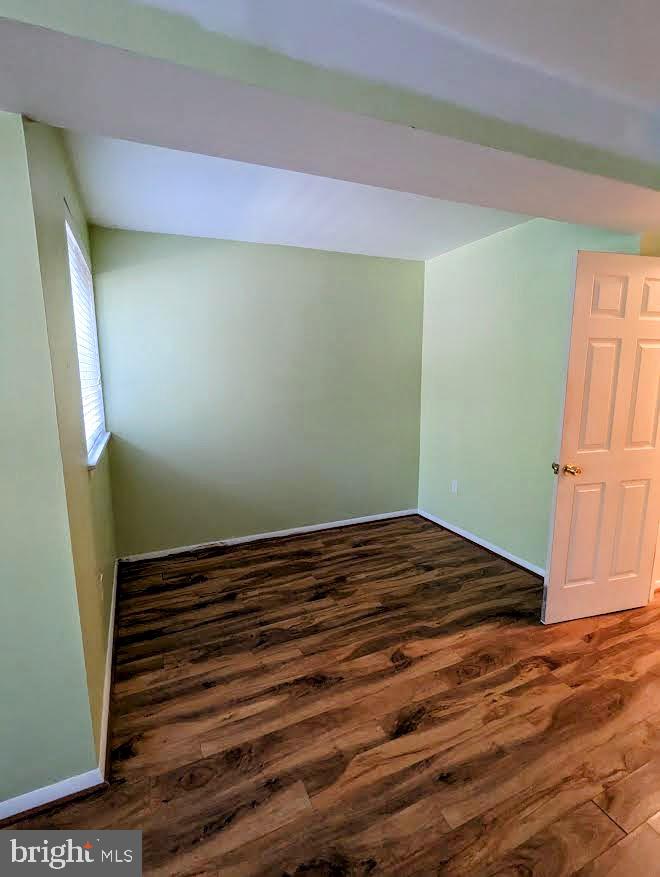 1621 Parkcrest Circle, Unit 101 Reston, VA 20190 - Photo 14 of 16 a view of a room with wooden floor and staircase