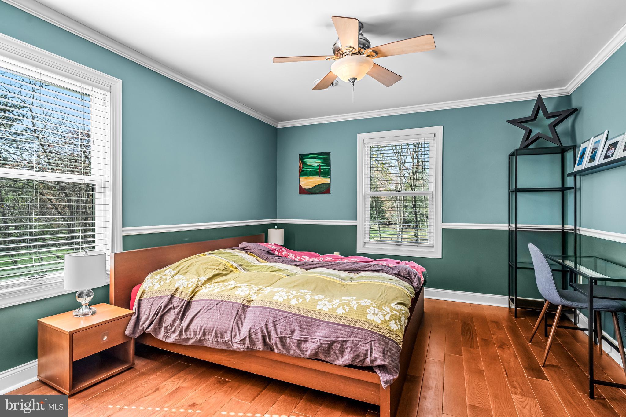 512 North Stanwick Road Moorestown, NJ 08057 - Photo 37 of 73 a bedroom with a bed a chandelier and a window