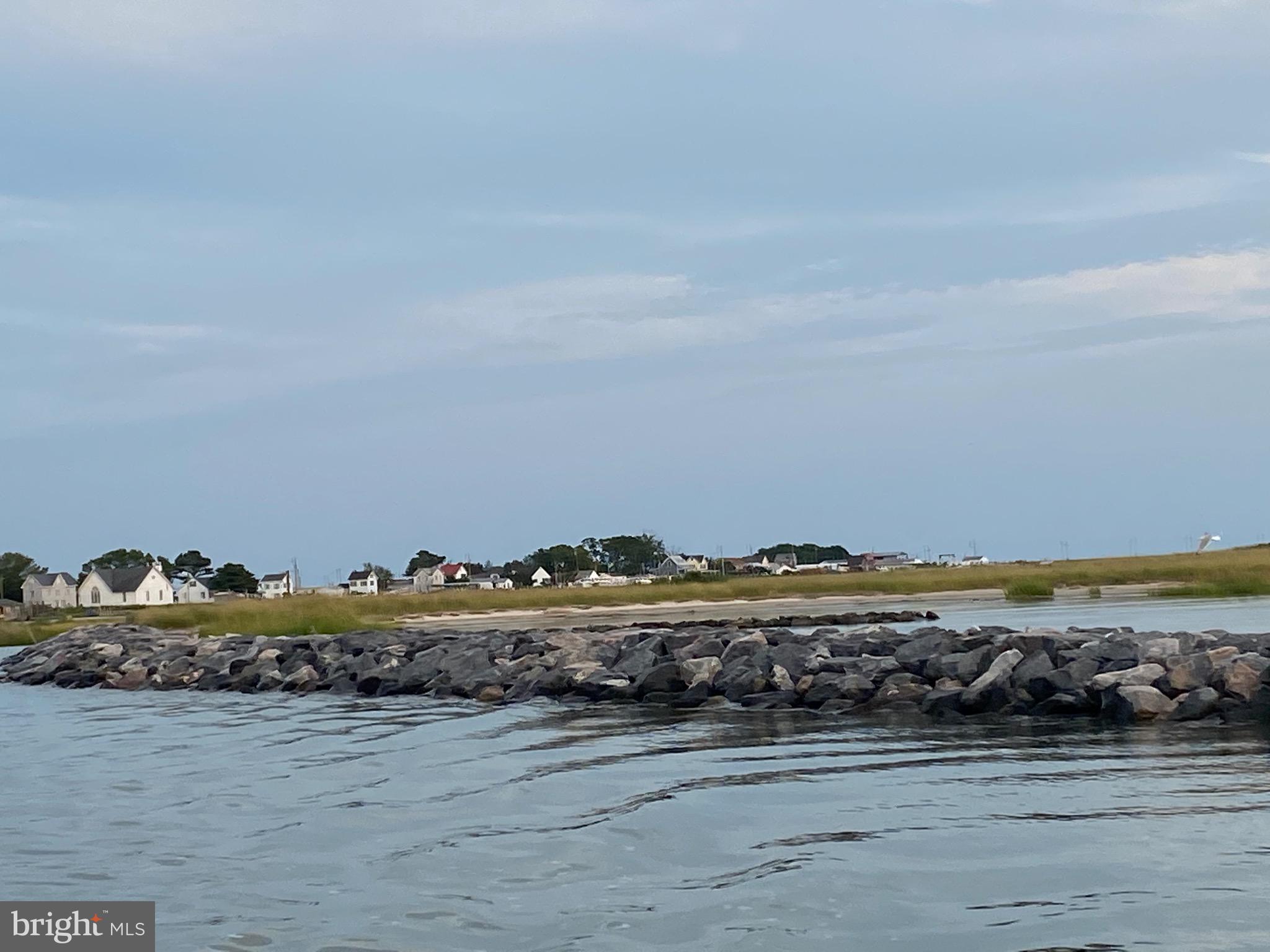 3424 Marsh Road Ewell, MD 21824 - Photo 10 of 18 a view of a lake and a car parked