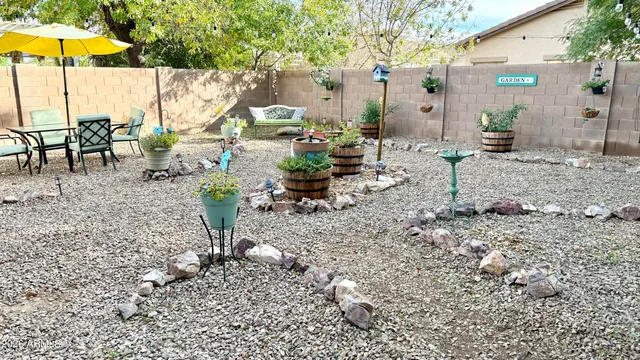 a view of a backyard with sitting area