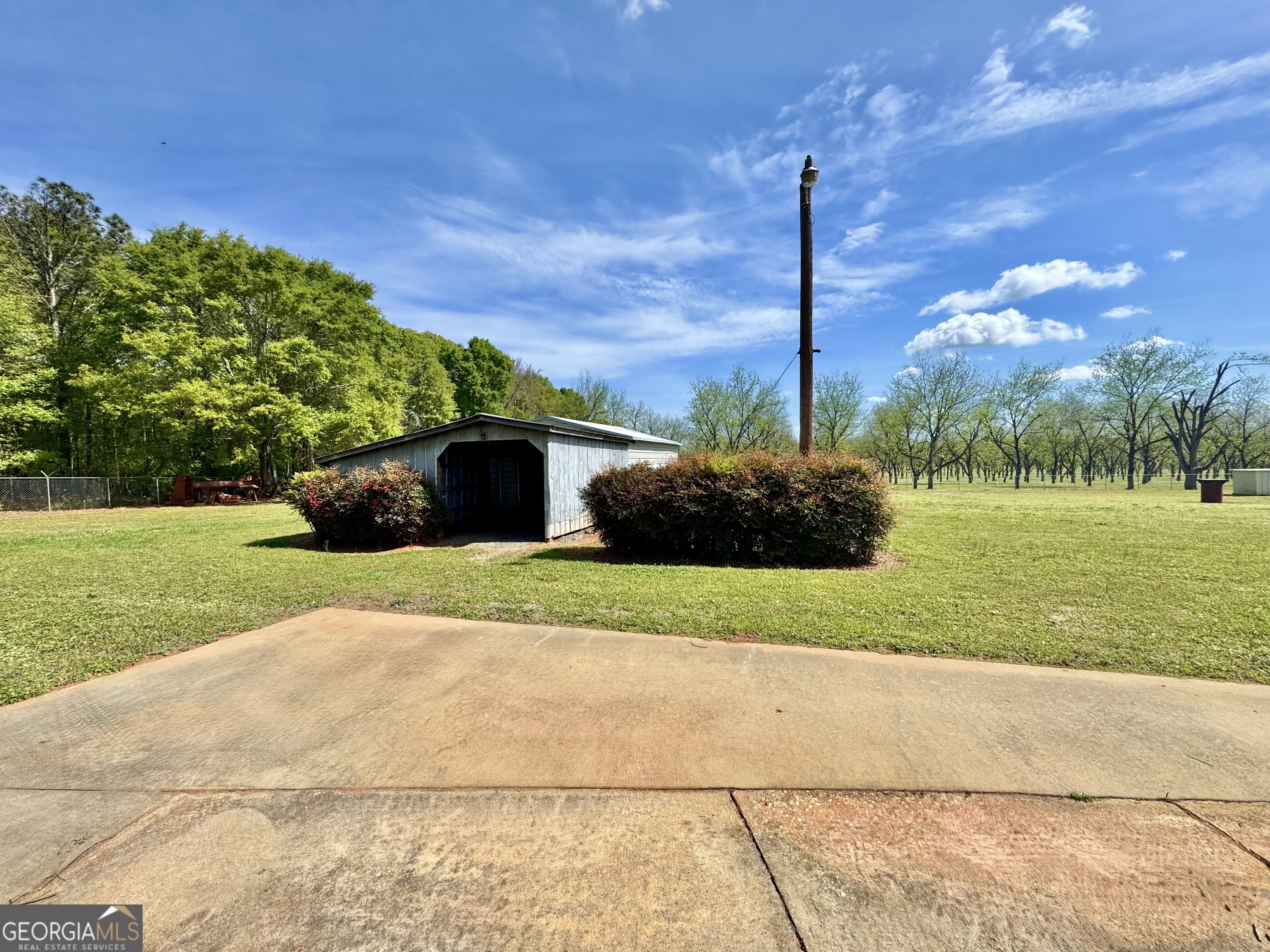 1760 Fears Road Rutledge, GA 30663 - Photo 61 of 68 a green field with some trees in the background
