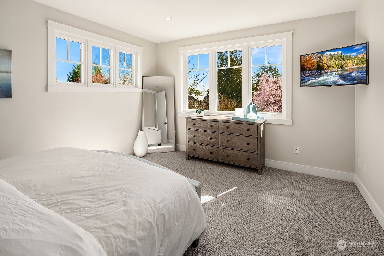5108 Northeast 42nd Street Seattle, WA 98105 - Photo 16 of 40 a spacious bedroom with a bed and a window