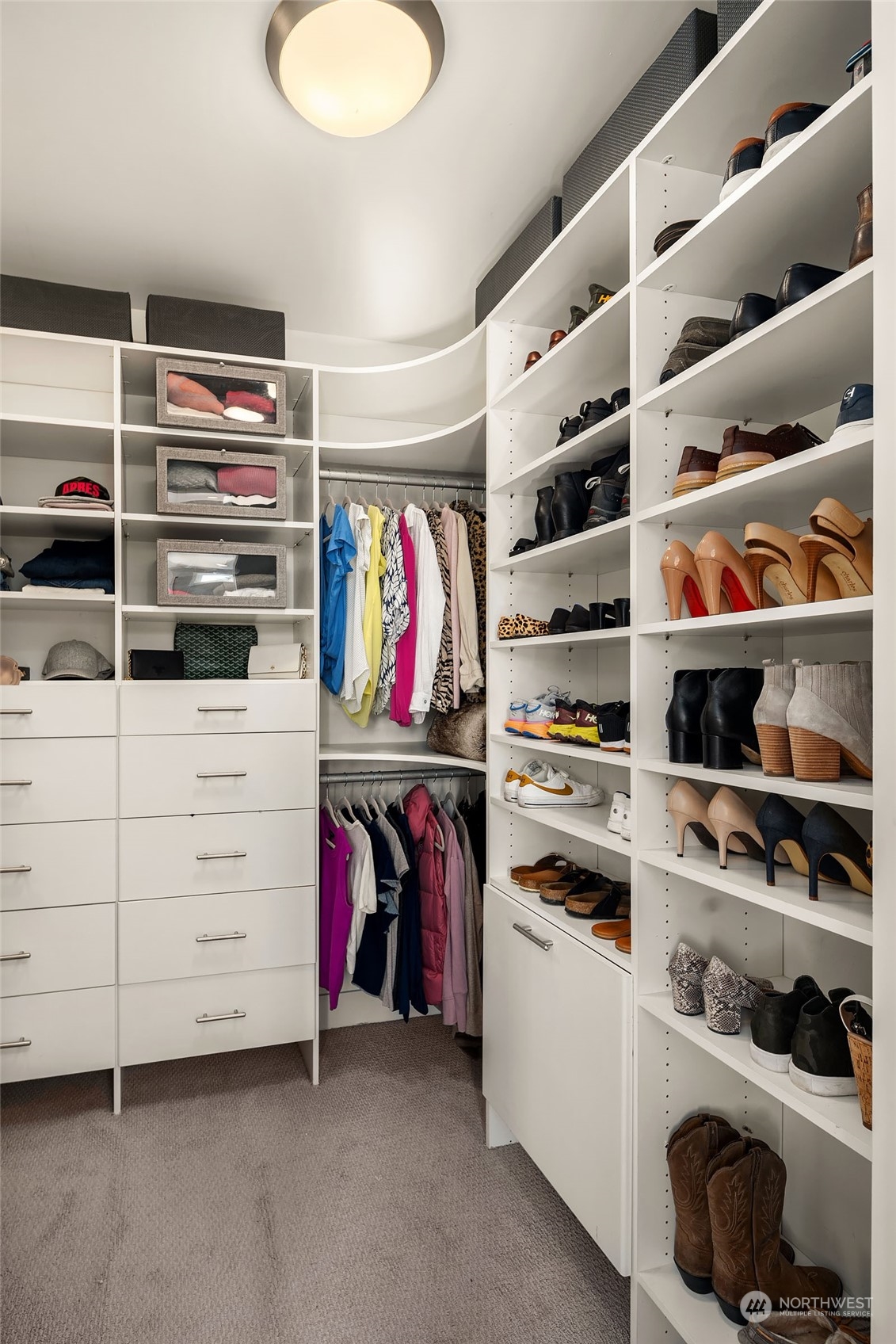 5108 Northeast 42nd Street Seattle, WA 98105 - Photo 18 of 40 a view of walk in closet with clothes and shoes