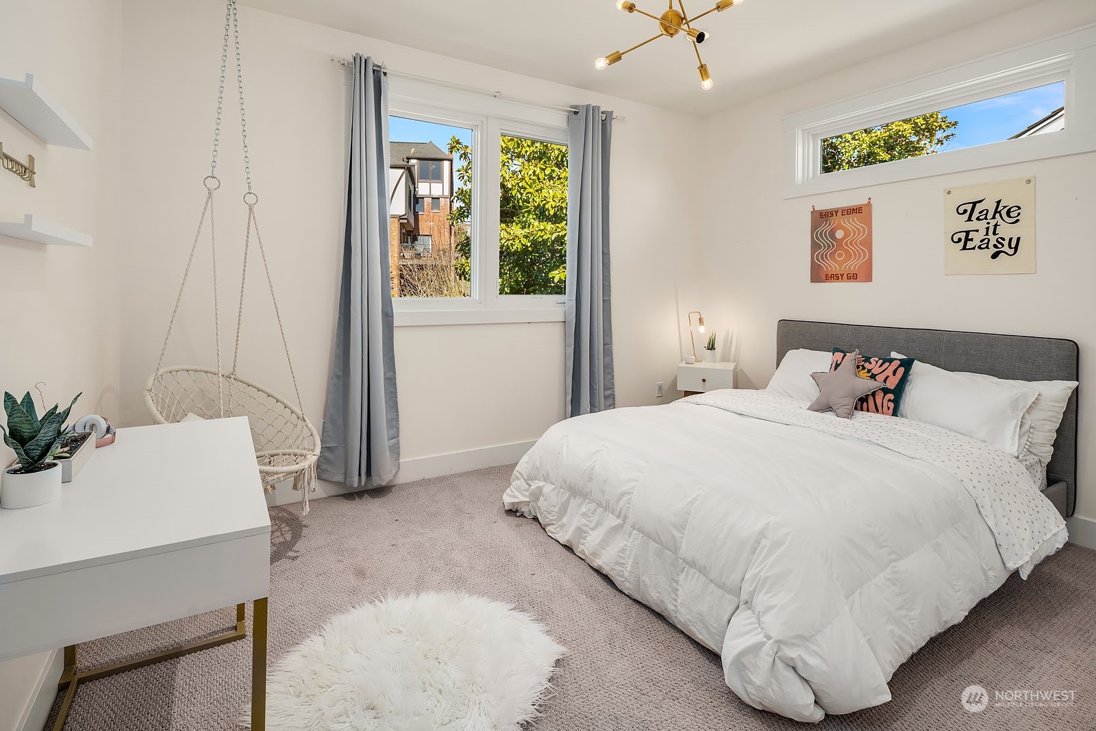 5108 Northeast 42nd Street Seattle, WA 98105 - Photo 20 of 40 a bedroom with a bed and a table