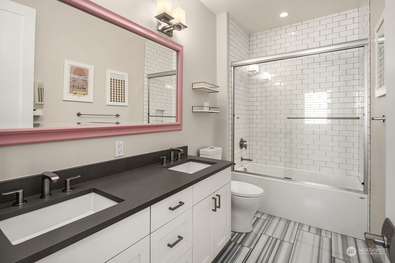 5108 Northeast 42nd Street Seattle, WA 98105 - Photo 21 of 40 a bathroom with a granite countertop sink a toilet a mirror and shower