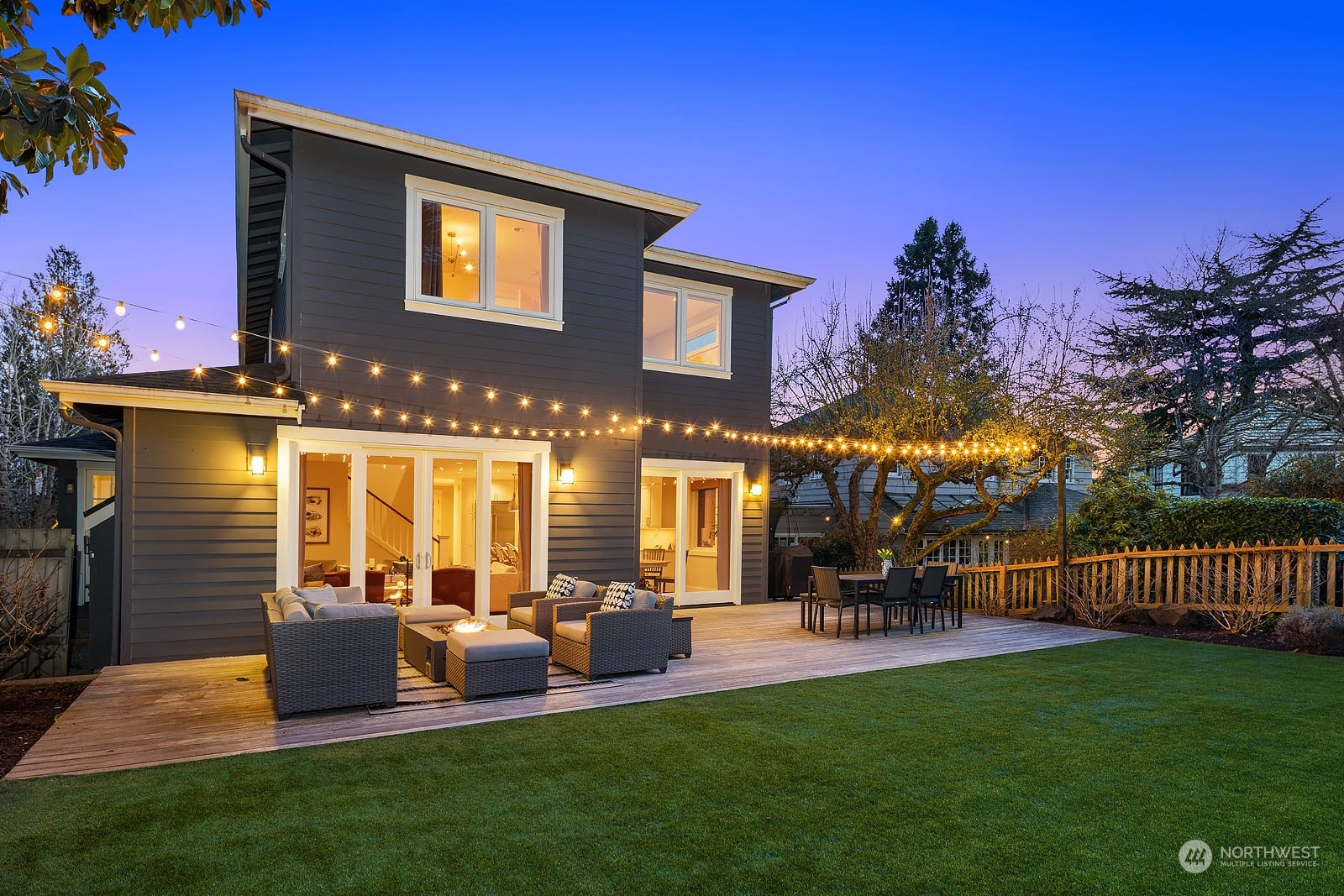 5108 Northeast 42nd Street Seattle, WA 98105 - Photo 30 of 40 a view of a house with a backyard porch and sitting area