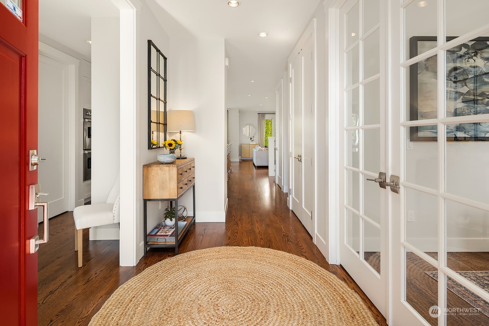 5108 Northeast 42nd Street Seattle, WA 98105 - Photo 3 of 40 a view of a bedroom with wooden floor and windows