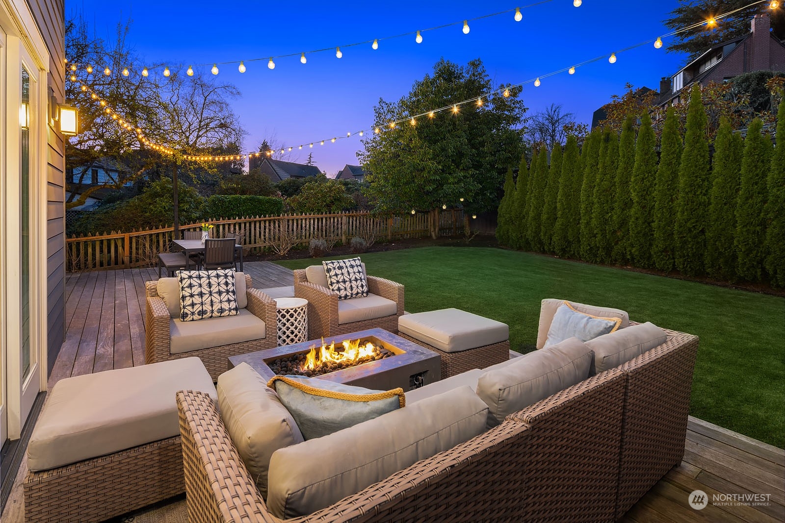 5108 Northeast 42nd Street Seattle, WA 98105 - Photo 32 of 40 a view of a patio with couches chairs and a yard