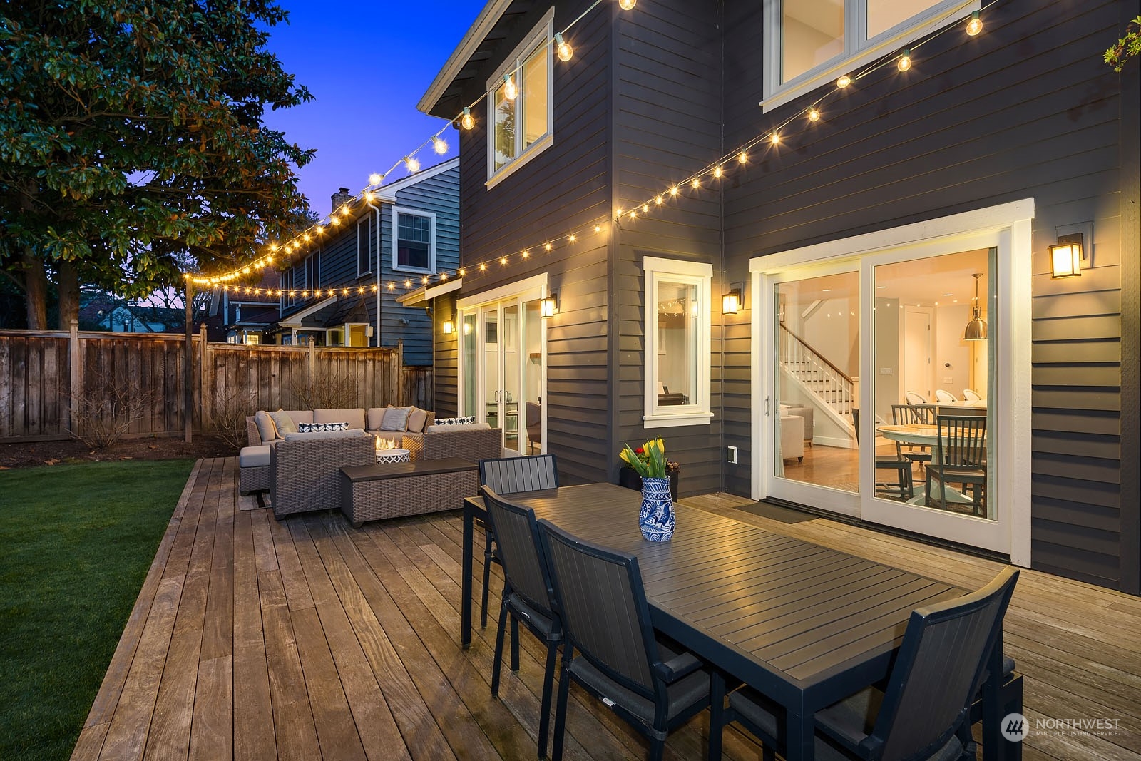 5108 Northeast 42nd Street Seattle, WA 98105 - Photo 34 of 40 a backyard of a house with table and chairs