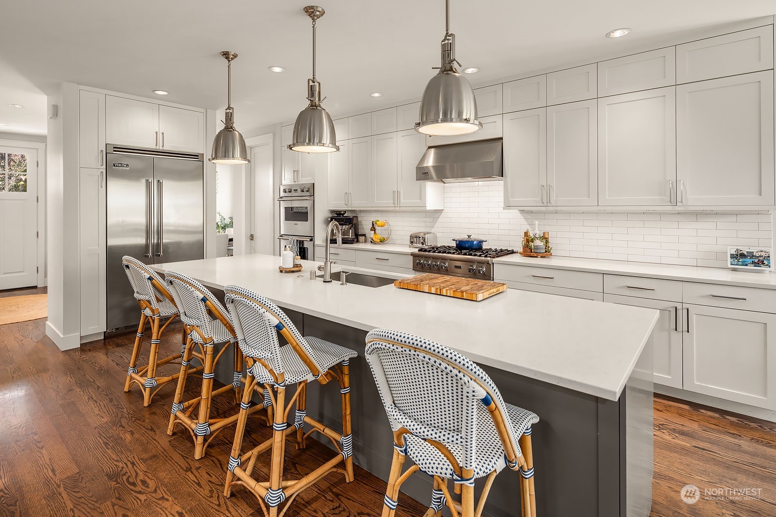 5108 Northeast 42nd Street Seattle, WA 98105 - Photo 7 of 40 a kitchen with a table chairs stove and cabinets