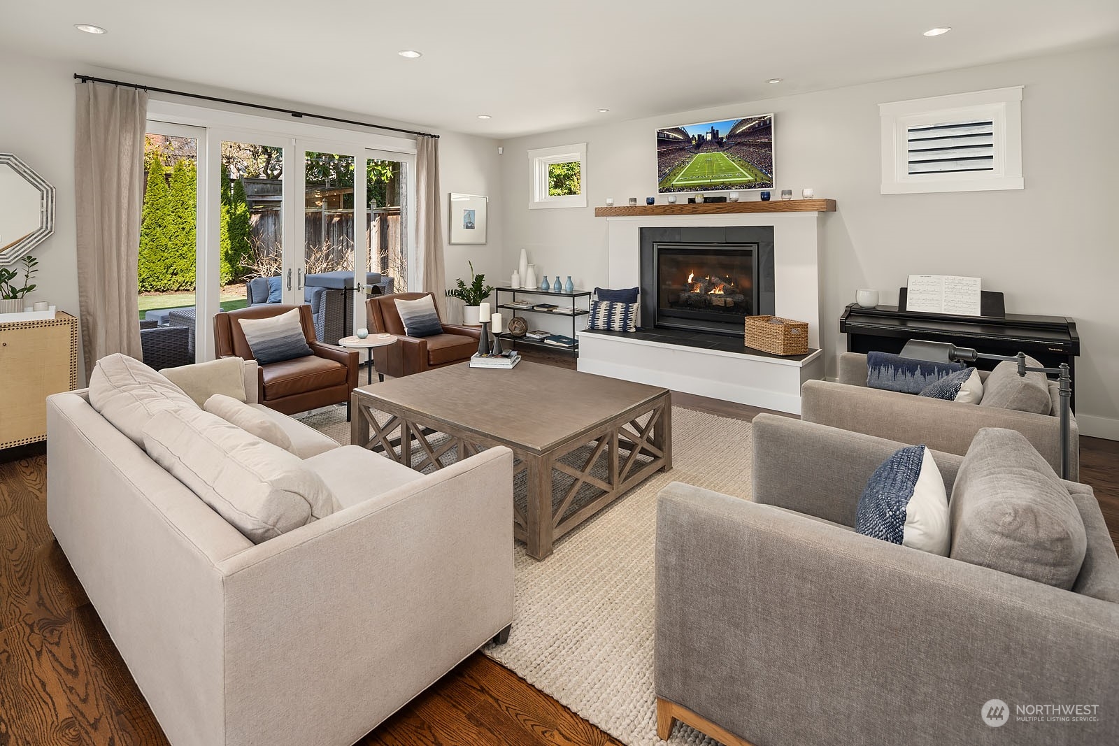 5108 Northeast 42nd Street Seattle, WA 98105 - Photo 10 of 40 a living room with furniture and a fireplace