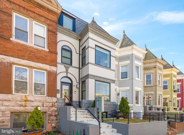 a front view of a residential houses with a street