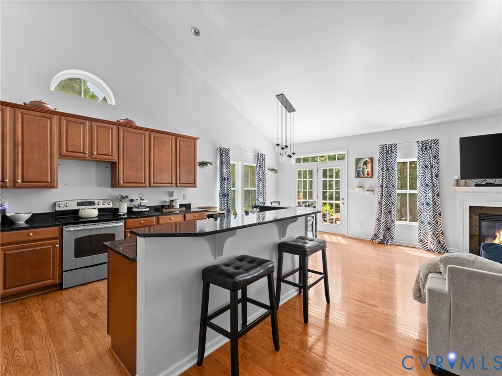 7434 South Franklins Way Quinton, VA 23141 - Photo 6 of 31 Kitchen featuring wood cabinetry, black countertop
