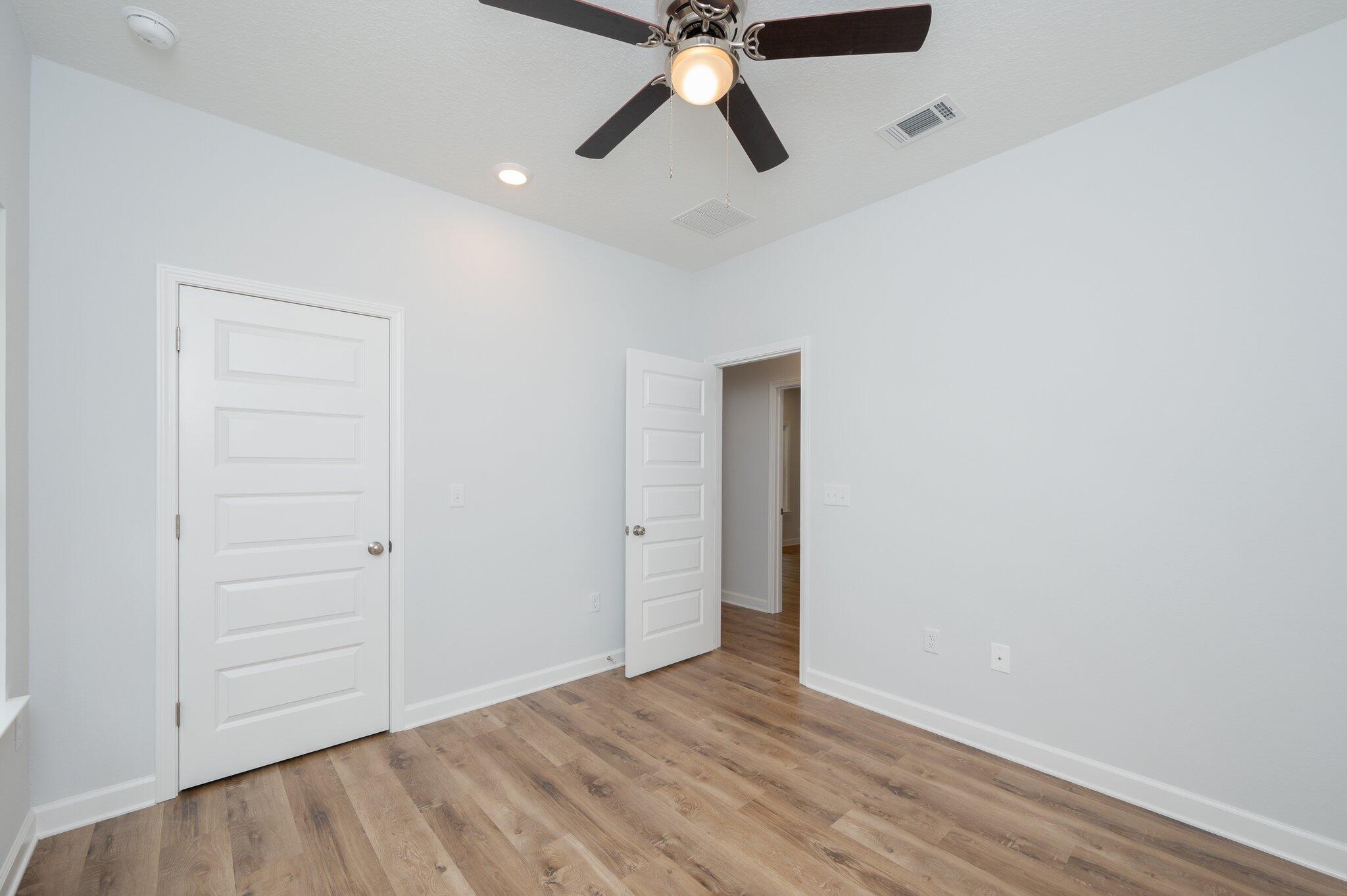 858 South Rayburn Street Crestview, FL 32539 - Photo 12 of 29 wooden floor in an empty room
