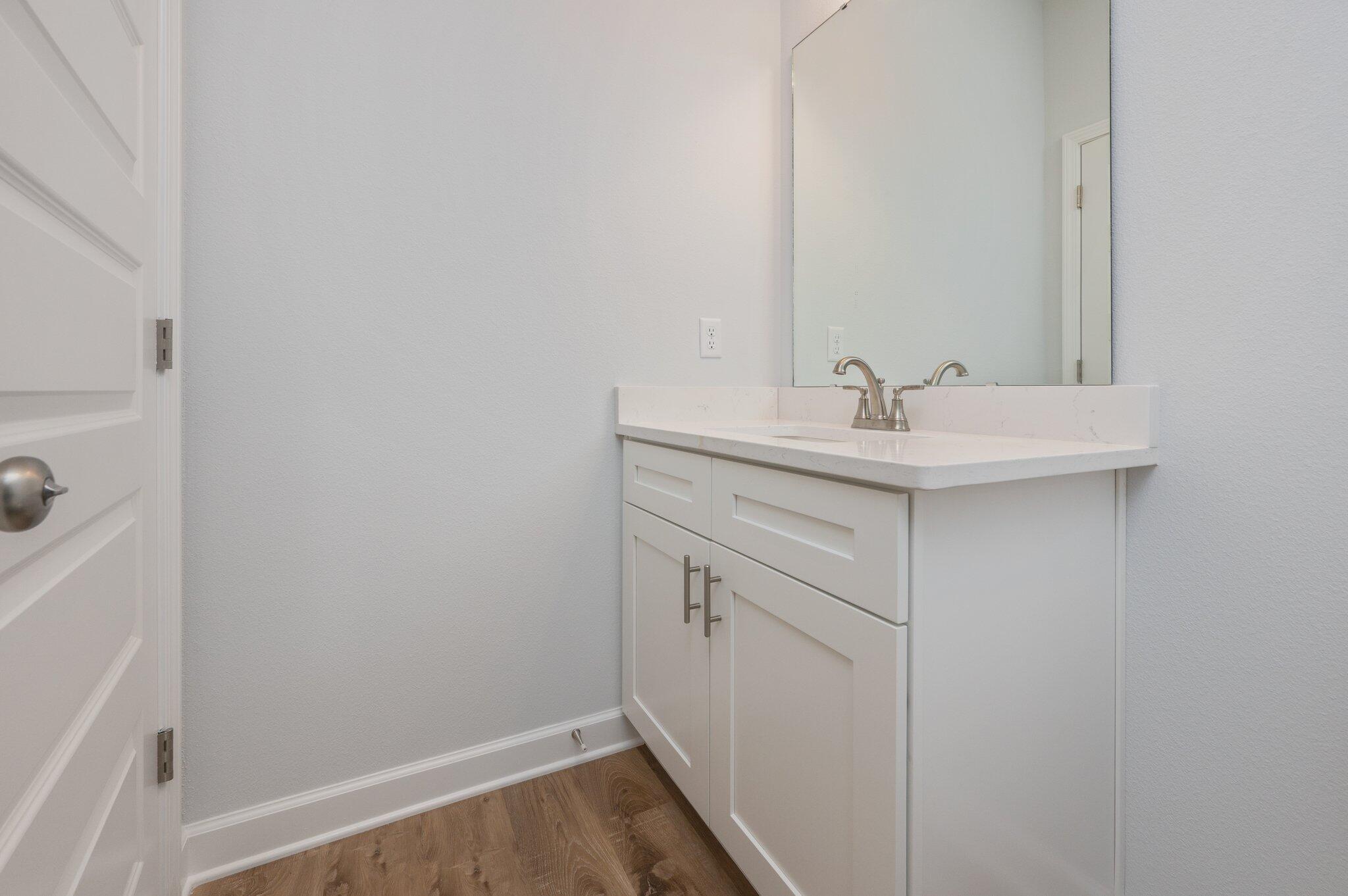 858 South Rayburn Street Crestview, FL 32539 - Photo 16 of 29 a bathroom with a sink and a mirror