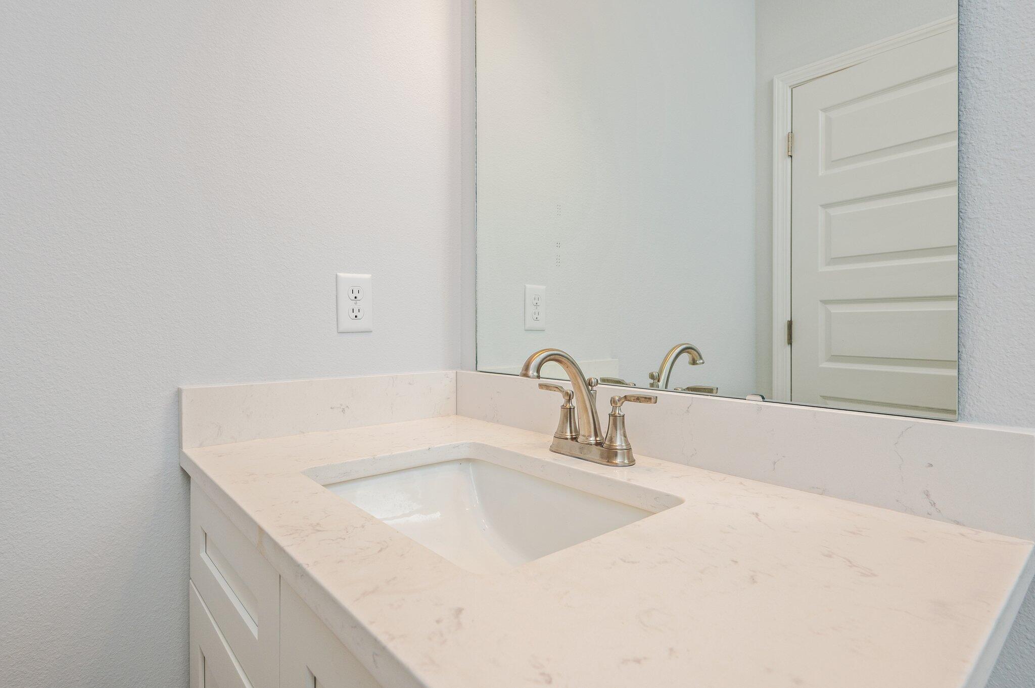 858 South Rayburn Street Crestview, FL 32539 - Photo 18 of 29 a bathroom with a sink and a tub