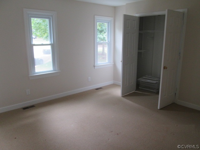 5707 Standing Oak Road Midlothian, VA 23112 - Photo 8 of 10 an empty room with windows