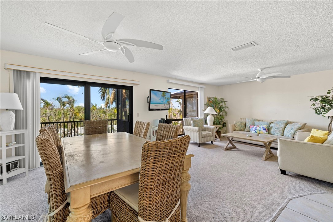 5117 Sea Bell Road, Unit B208 Sanibel, FL 33957 - Photo 8 of 25 a living room with furniture and a large window
