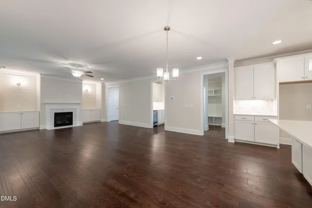 a view of an entryway with wooden floor