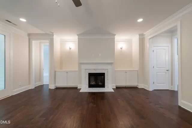 a view of entryway with wooden floor and front door