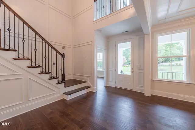 a bathroom with double sink and a mirror