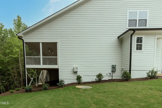 a view of a backyard with plants and garden
